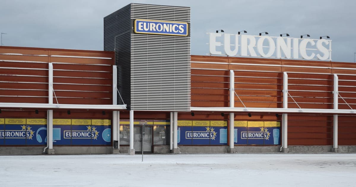The exterior of a Euronics store in winter, with the brand sign above the entrance and snow across the forecourt