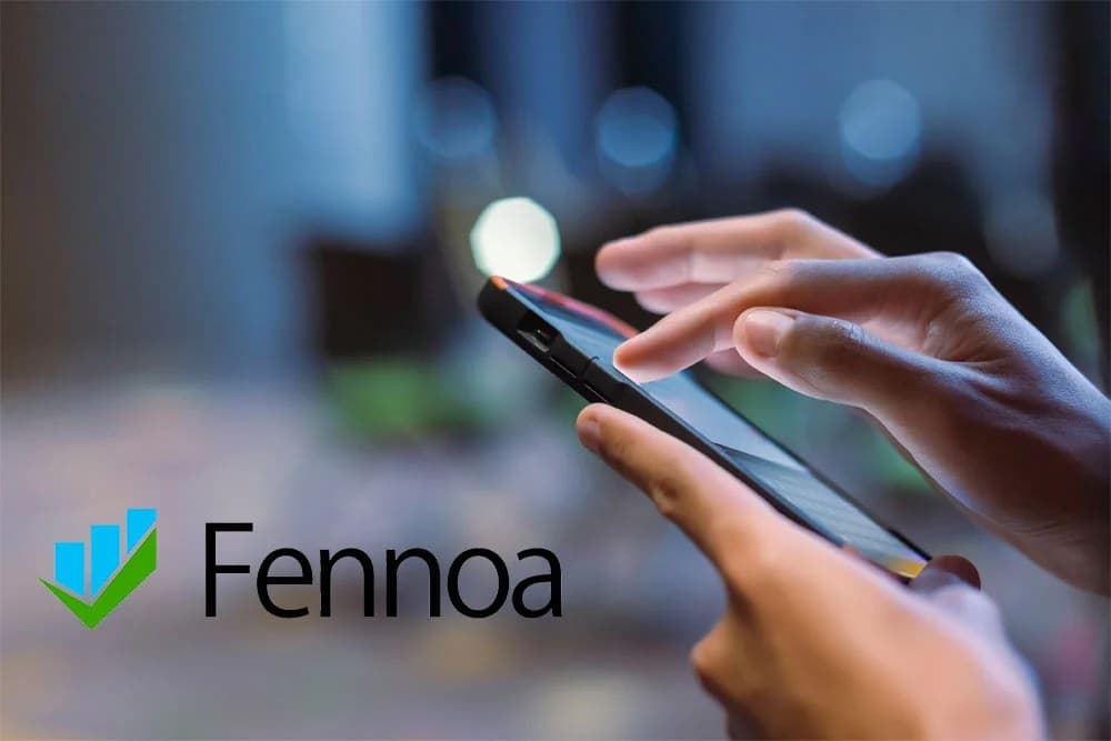 The Fennoa logo over a photograph of hands using a smartphone in low light