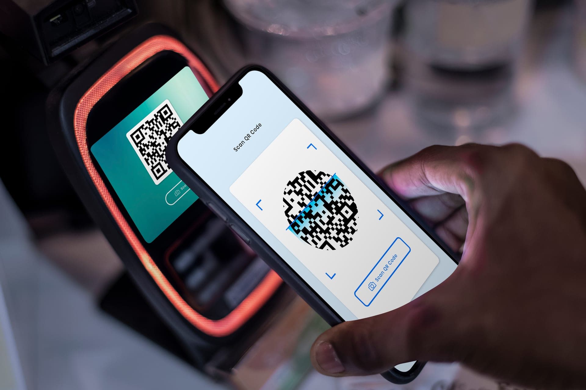 Phone scanning QR code on payment terminal